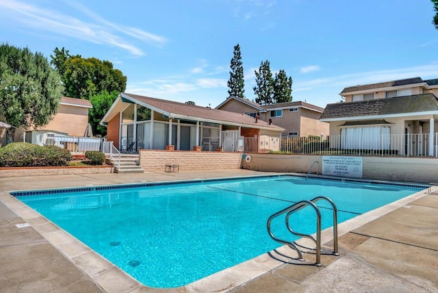 view of swimming pool with a patio area