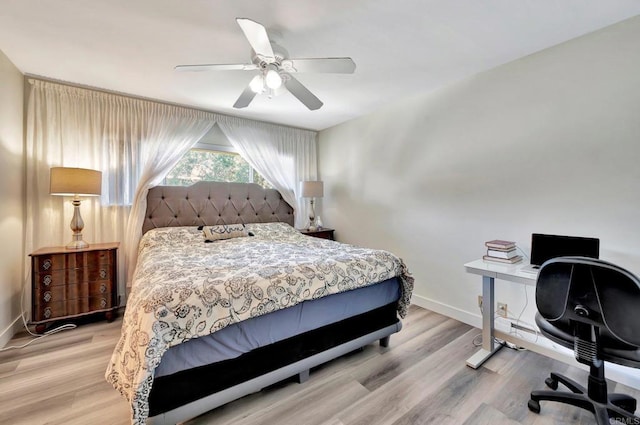 bedroom with ceiling fan and light wood-type flooring