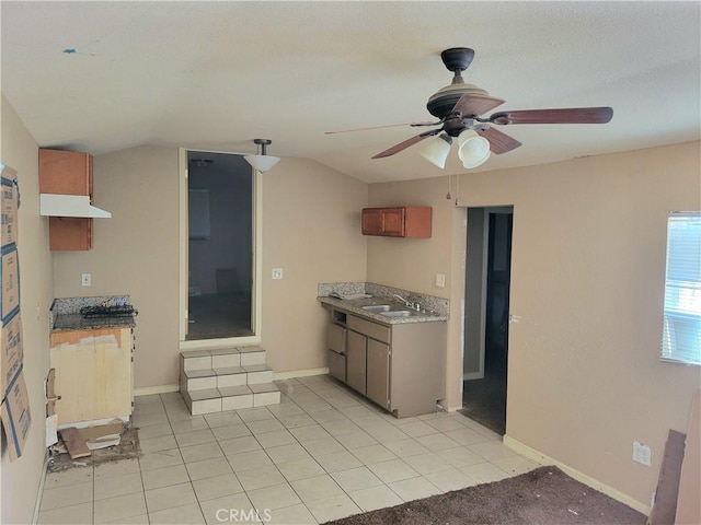 23960 Norma Dr, Menifee, CA 92587 - kitchen with light tile patterned floors, ceiling fan, lofted ceiling, and sink