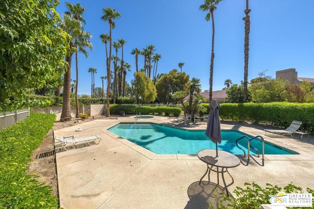 view of swimming pool featuring a patio