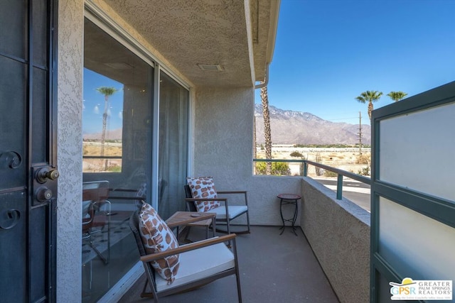 balcony featuring a mountain view