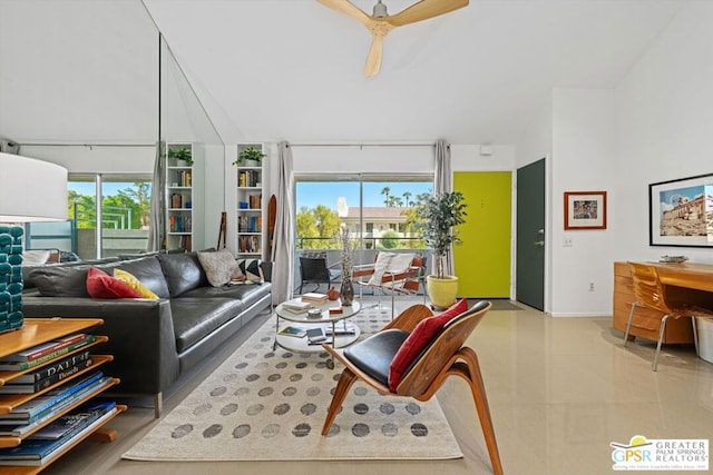 living room featuring ceiling fan, light tile patterned flooring, and a healthy amount of sunlight