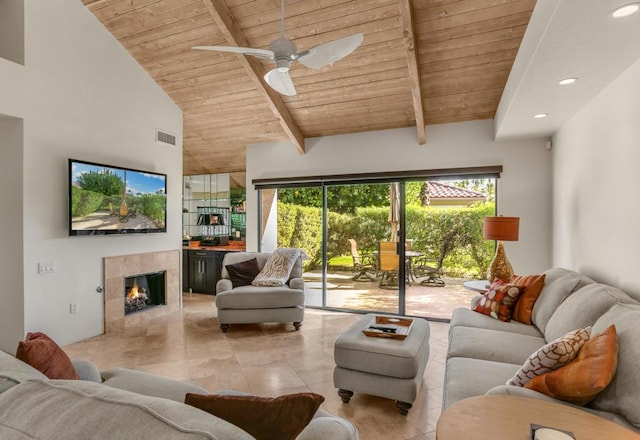 tiled living room featuring wooden ceiling, ceiling fan, and a healthy amount of sunlight