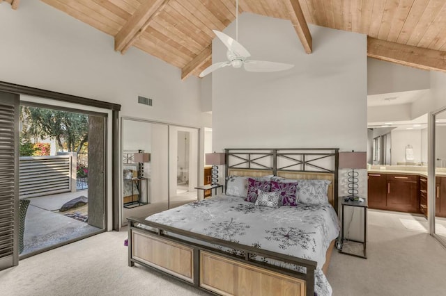 bedroom featuring ceiling fan, beam ceiling, wooden ceiling, and light carpet