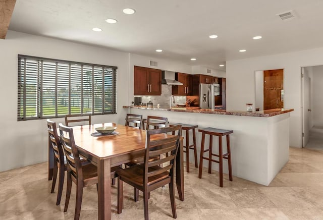 dining room featuring sink