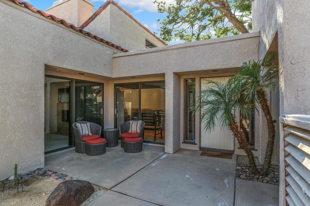 property entrance featuring a patio