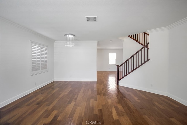 interior space featuring an inviting chandelier, dark hardwood / wood-style floors, and crown molding