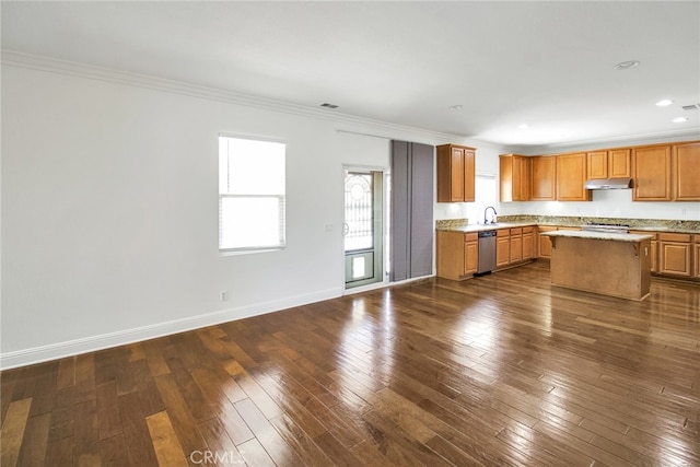 kitchen featuring dishwasher, dark hardwood / wood-style floors, sink, a kitchen island, and crown molding