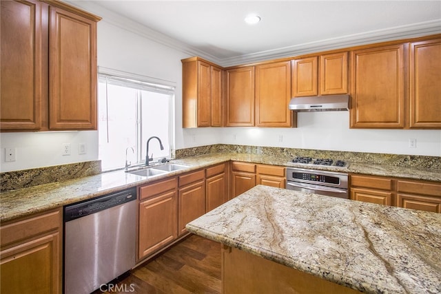 kitchen with stainless steel appliances, light stone counters, dark hardwood / wood-style floors, and sink