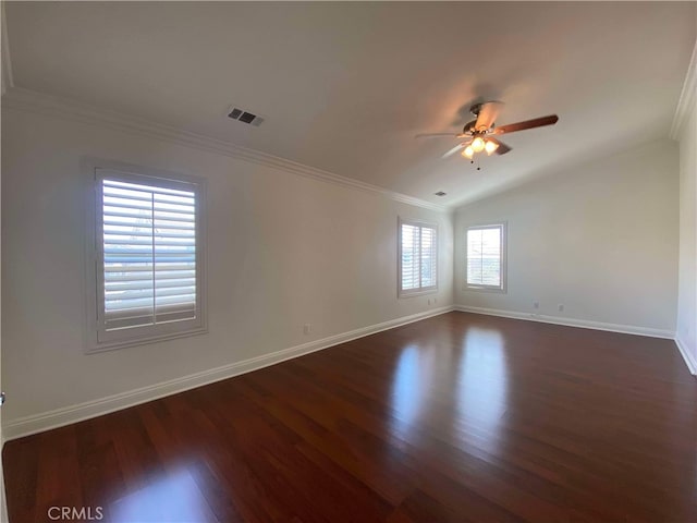 unfurnished room with ornamental molding, ceiling fan, dark wood-type flooring, and vaulted ceiling