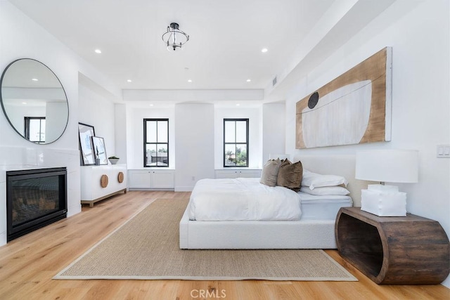 bedroom with light hardwood / wood-style floors