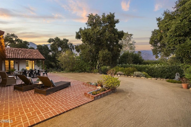 view of patio terrace at dusk