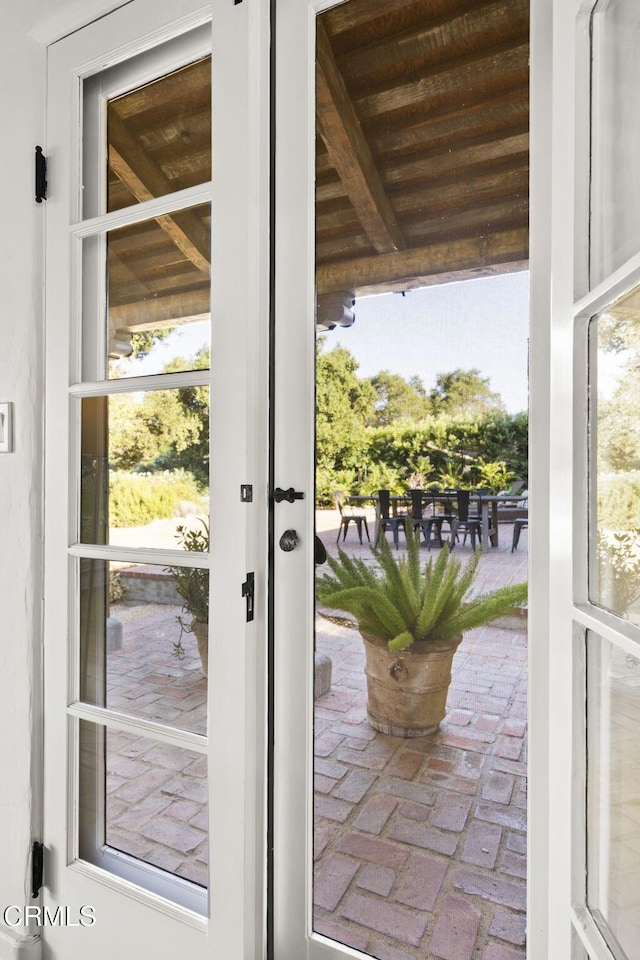 doorway featuring brick floor