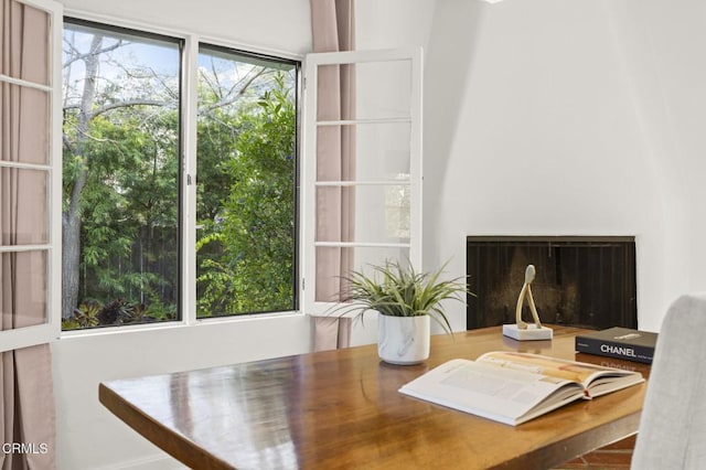 office area with a fireplace