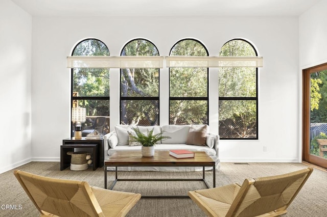 living room with baseboards and carpet flooring