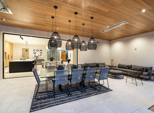 dining room with light tile patterned flooring and wooden ceiling