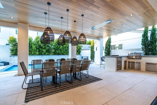 view of patio with grilling area and an outdoor kitchen