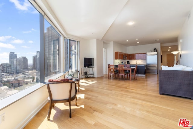 living room with light hardwood / wood-style floors