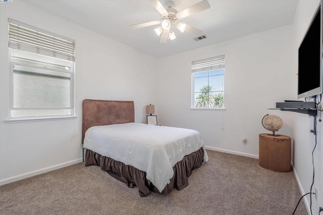 carpeted bedroom with ceiling fan