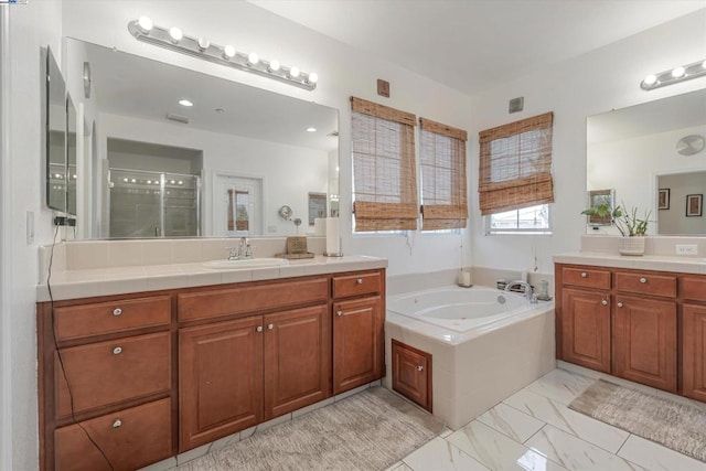 bathroom with plus walk in shower and vanity