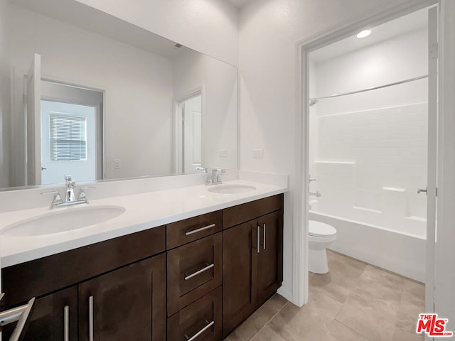 full bathroom featuring tile patterned flooring, shower / washtub combination, vanity, and toilet