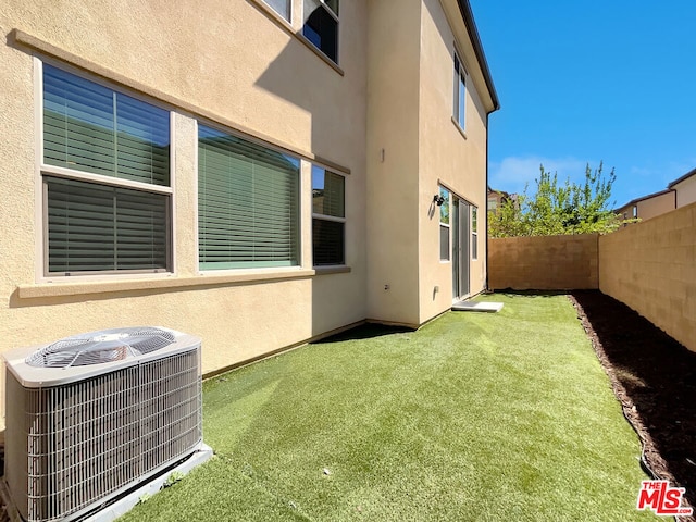 view of yard featuring central AC unit