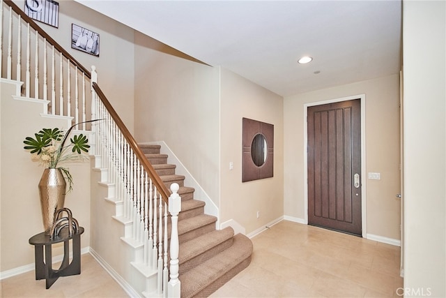 foyer with light tile patterned flooring