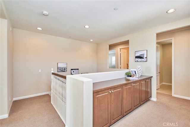 kitchen with light colored carpet