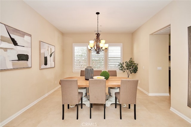 dining space with an inviting chandelier and light tile patterned floors