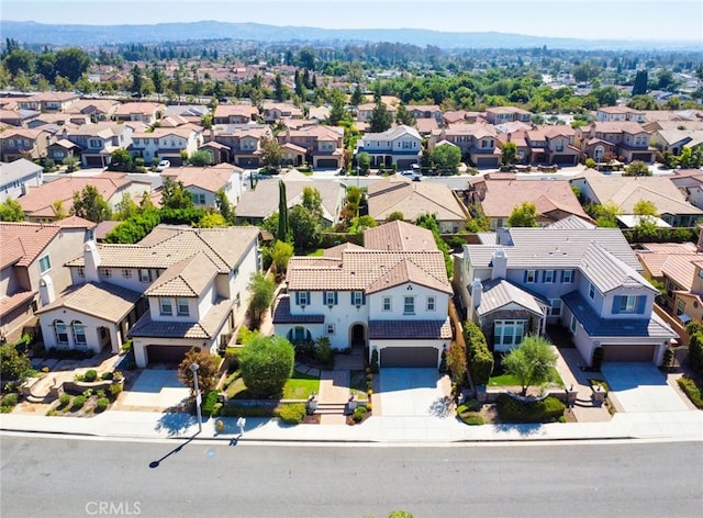 birds eye view of property with a mountain view