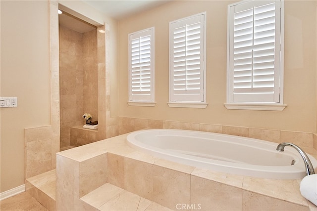 bathroom with tiled tub