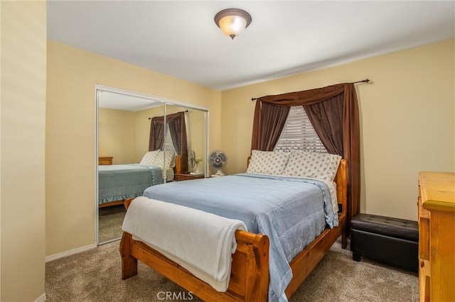 bedroom with carpet floors and a closet