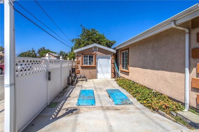 view of patio featuring a shed