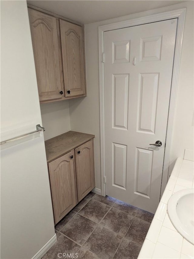 3310 Tripoli Way, Oceanside, CA 92056 - kitchen featuring tile countertops, freestanding refrigerator, a sink, and baseboards