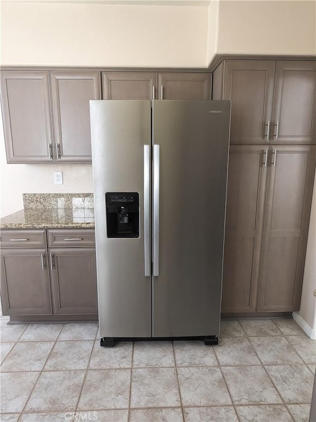 3310 Tripoli Way, Oceanside, CA 92056 - kitchen featuring stainless steel refrigerator with ice dispenser and light stone counters