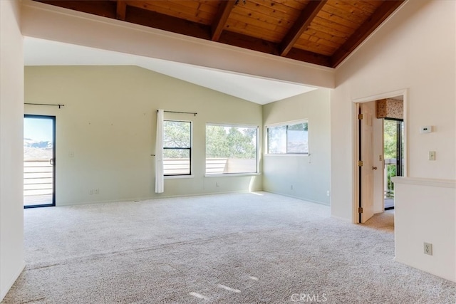 carpeted spare room featuring lofted ceiling with beams and wooden ceiling