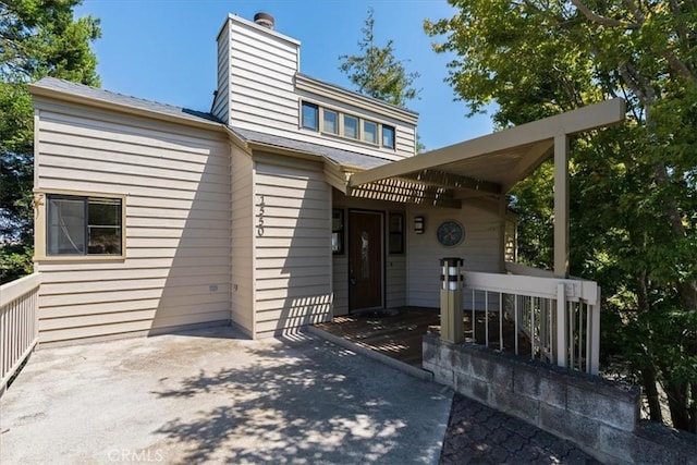 1550 Pineridge Dr, Cambria, CA 93428 - exterior space featuring a chimney and a wooden deck
