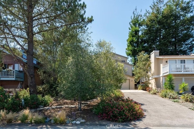 1550 Pineridge Dr, Cambria, CA 93428 - exterior space with a garage, a chimney, and aphalt driveway