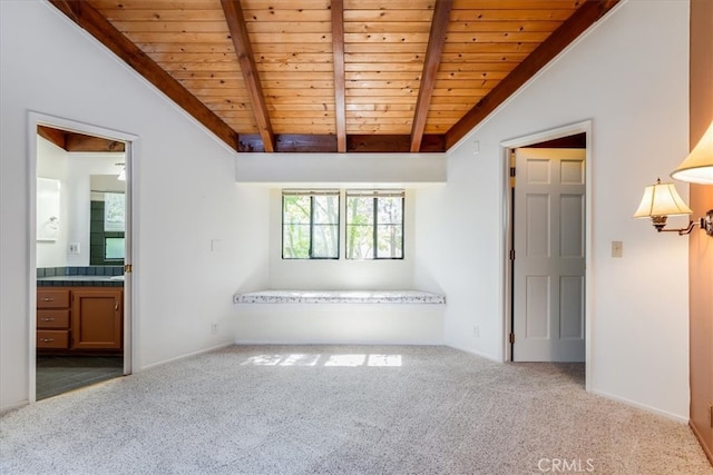 unfurnished room featuring vaulted ceiling with beams, wooden ceiling, and carpet flooring