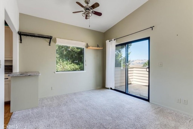 1550 Pineridge Dr, Cambria, CA 93428 - carpeted spare room with a ceiling fan and lofted ceiling