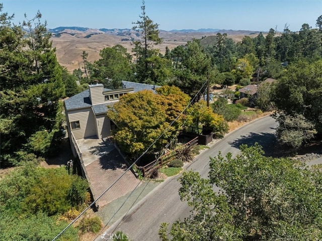 birds eye view of property with a mountain view