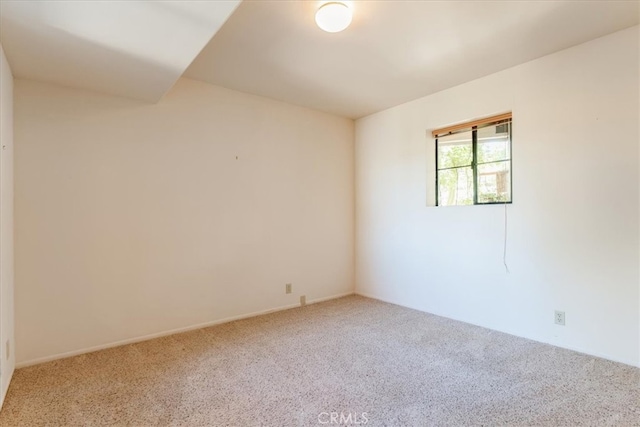 spare room with carpet floors