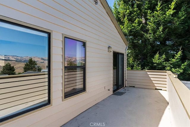 view of side of home featuring a mountain view