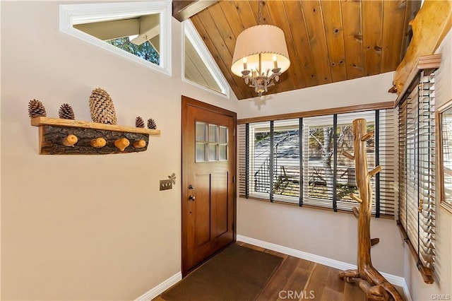 doorway with vaulted ceiling with beams, an inviting chandelier, plenty of natural light, and dark wood-type flooring