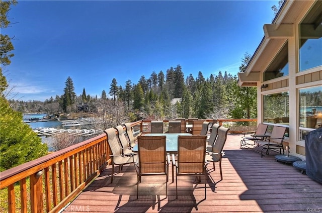 wooden terrace featuring a water view