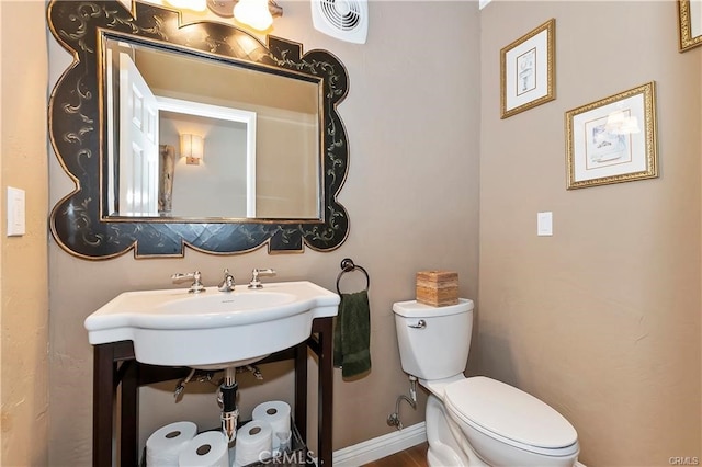 bathroom featuring sink and toilet