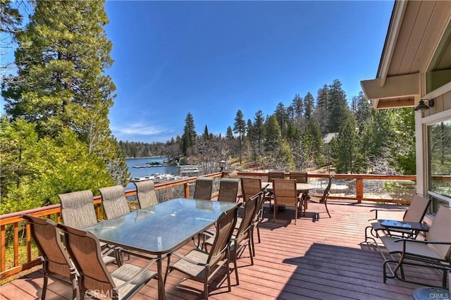 wooden deck featuring a water view