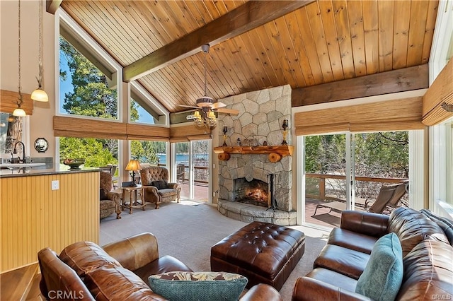 living room with high vaulted ceiling, wood ceiling, beamed ceiling, and light colored carpet