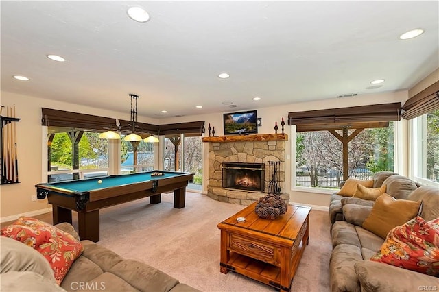 recreation room featuring light carpet, billiards, a fireplace, and a healthy amount of sunlight