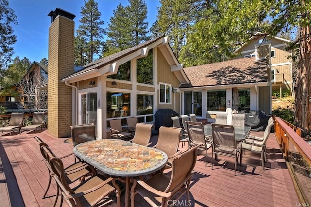 wooden deck featuring area for grilling